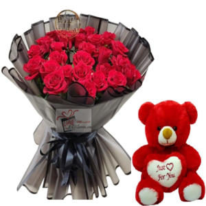 Red flower in black packaging with teddy